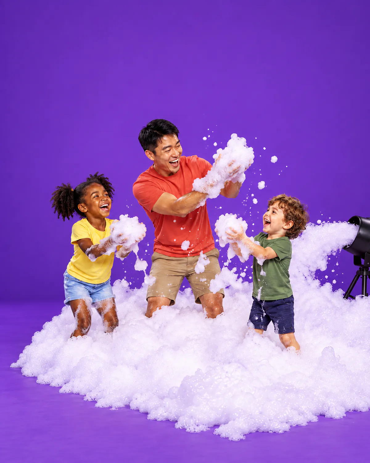 A host and two children throwing party foam