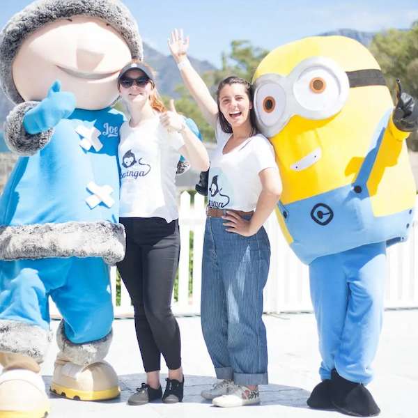 Costumed mascot characters entertaining guests at an outdoor event